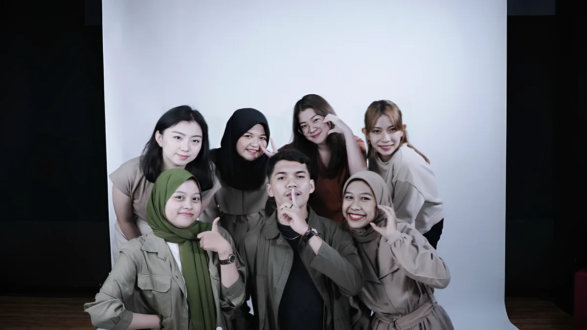 Alika with the Ciputra Film Festival team in a playful group photo